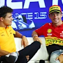 MONZA, ITALY - AUGUST 31: Charles Leclerc of Monaco and Ferrari and Lando Norris of Great Britain and McLaren talk in the Drivers Press Conference during previews ahead of the F1 Grand Prix of Italy at Autodromo Nazionale Monza on August 31, 2023 in Monza, Italy. (Photo by Bryn Lennon/Getty Images)