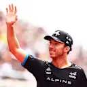 SUZUKA, JAPAN - SEPTEMBER 24: Pierre Gasly of France and Alpine F1 waves from the drivers parade prior to the F1 Grand Prix of Japan at Suzuka International Racing Course on September 24, 2023 in Suzuka, Japan. (Photo by Clive Rose/Getty Images)
