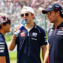 SUZUKA, JAPAN - SEPTEMBER 24: Liam Lawson of New Zealand and Scuderia AlphaTauri talks with Yuki Tsunoda of Japan and Scuderia AlphaTauri and Sergio Perez of Mexico and Oracle Red Bull Racing on the drivers parade prior to the F1 Grand Prix of Japan at Suzuka International Racing Course on September 24, 2023 in Suzuka, Japan. (Photo by Mark Thompson/Getty Images)