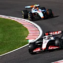 SUZUKA, JAPAN - SEPTEMBER 24: Kevin Magnussen of Denmark driving the (20) Haas F1 VF-23 Ferrari leads Logan Sargeant of United States driving the (2) Williams FW45 Mercedes during the F1 Grand Prix of Japan at Suzuka International Racing Course on September 24, 2023 in Suzuka, Japan. (Photo by Clive Rose/Getty Images)