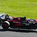 SUZUKA, JAPAN - SEPTEMBER 24: Valtteri Bottas of Finland driving the (77) Alfa Romeo F1 C43 Ferrari collides with Logan Sargeant of United States driving the (2) Williams FW45 Mercedes during the F1 Grand Prix of Japan at Suzuka International Racing Course on September 24, 2023 in Suzuka, Japan. (Photo by Clive Mason/Getty Images)