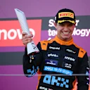 SUZUKA, JAPAN - SEPTEMBER 24: Second placed Lando Norris of Great Britain and McLaren celebrates on the podium during the F1 Grand Prix of Japan at Suzuka International Racing Course on September 24, 2023 in Suzuka, Japan. (Photo by Clive Mason/Getty Images)