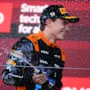 SUZUKA, JAPAN - SEPTEMBER 24: Third placed Oscar Piastri of Australia and McLaren celebrates on the podium during the F1 Grand Prix of Japan at Suzuka International Racing Course on September 24, 2023 in Suzuka, Japan. (Photo by Clive Mason/Getty Images)
