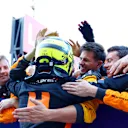SUZUKA, JAPAN - SEPTEMBER 24: Second placed Lando Norris of Great Britain and McLaren celebrates with his team in parc ferme during the F1 Grand Prix of Japan at Suzuka International Racing Course on September 24, 2023 in Suzuka, Japan. (Photo by Dan Istitene - Formula 1/Formula 1 via Getty Images)