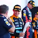 SUZUKA, JAPAN - SEPTEMBER 24: Second placed Lando Norris of Great Britain and McLaren talks with Red Bull Racing Team Principal Christian Horner on the podium during the F1 Grand Prix of Japan at Suzuka International Racing Course on September 24, 2023 in Suzuka, Japan. (Photo by Dan Istitene - Formula 1/Formula 1 via Getty Images)