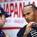 SUZUKA, JAPAN - SEPTEMBER 21: Lewis Hamilton of Great Britain and Mercedes talks with Sergio Perez of Mexico and Oracle Red Bull Racing in the Drivers Press Conference during previews ahead of the F1 Grand Prix of Japan at Suzuka International Racing Course on September 21, 2023 in Suzuka, Japan. (Photo by Clive Rose/Getty Images)