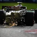 SUZUKA, JAPAN - SEPTEMBER 23: Sparks fly behind Lewis Hamilton of Great Britain driving the (44) Mercedes AMG Petronas F1 Team W14 during qualifying ahead of the F1 Grand Prix of Japan at Suzuka International Racing Course on September 23, 2023 in Suzuka, Japan. (Photo by Clive Mason/Getty Images)