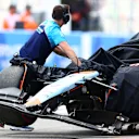 SUZUKA, JAPAN - SEPTEMBER 23: The car of Logan Sargeant of United States and Williams is pushed back into the garage after a crash during qualifying ahead of the F1 Grand Prix of Japan at Suzuka International Racing Course on September 23, 2023 in Suzuka, Japan. (Photo by Dan Istitene - Formula 1/Formula 1 via Getty Images)