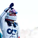 SUZUKA, JAPAN - SEPTEMBER 23: 9th placed qualifier Yuki Tsunoda of Japan and Scuderia AlphaTauri waves to the crowd from parc ferme during qualifying ahead of the F1 Grand Prix of Japan at Suzuka International Racing Course on September 23, 2023 in Suzuka, Japan. (Photo by Rudy Carezzevoli/Getty Images)