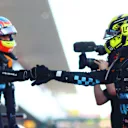 SUZUKA, JAPAN - SEPTEMBER 23:  Second placed qualifier Oscar Piastri of Australia and McLaren celebrates with Third placed qualifier Lando Norris of Great Britain and McLaren in parc ferme during qualifying ahead of the F1 Grand Prix of Japan at Suzuka International Racing Course on September 23, 2023 in Suzuka, Japan. (Photo by Dan Istitene - Formula 1/Formula 1 via Getty Images)