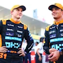 SUZUKA, JAPAN - SEPTEMBER 23:  Second placed qualifier Oscar Piastri of Australia and McLaren talks with Third placed qualifier Lando Norris of Great Britain and McLaren in parc ferme during qualifying ahead of the F1 Grand Prix of Japan at Suzuka International Racing Course on September 23, 2023 in Suzuka, Japan. (Photo by Dan Istitene - Formula 1/Formula 1 via Getty Images)
