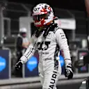 LAS VEGAS, NEVADA - NOVEMBER 18: 20th placed qualifier Yuki Tsunoda of Japan and Scuderia AlphaTauri walks in the pitlane after qualifying ahead of the F1 Grand Prix of Las Vegas at Las Vegas Strip Circuit on November 18, 2023 in Las Vegas, Nevada. (Photo by Rudy Carezzevoli/Getty Images)