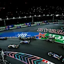 LAS VEGAS, NEVADA - NOVEMBER 18: Fernando Alonso of Spain driving the (14) Aston Martin AMR23 Mercedes and Valtteri Bottas of Finland driving the (77) Alfa Romeo F1 C43 Ferrari collide at turn one during the F1 Grand Prix of Las Vegas at Las Vegas Strip Circuit on November 18, 2023 in Las Vegas, Nevada. (Photo by Chris Graythen/Getty Images)