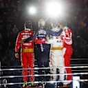 LAS VEGAS, NEVADA - NOVEMBER 18: Race winner Max Verstappen of the Netherlands and Oracle Red Bull Racing, Second placed Charles Leclerc of Monaco and Ferrari and Third placed Sergio Perez of Mexico and Oracle Red Bull Racing celebrate on the podium during the F1 Grand Prix of Las Vegas at Las Vegas Strip Circuit on November 18, 2023 in Las Vegas, Nevada. (Photo by Chris Graythen/Getty Images)