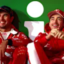 LAS VEGAS, NEVADA - NOVEMBER 18: Third placed Sergio Perez of Oracle Red Bull Racing and Second placed Charles Leclerc of Monaco and Ferrari react during the F1 Grand Prix of Las Vegas at Las Vegas Strip Circuit on November 18, 2023 in Las Vegas, Nevada. (Photo by Dan Istitene - Formula 1/Formula 1 via Getty Images)