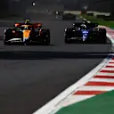 MEXICO CITY, MEXICO - OCTOBER 29: Lando Norris of Great Britain driving the (4) McLaren MCL60 Mercedes leads Alexander Albon of Thailand driving the (23) Williams FW45 Mercedes during the F1 Grand Prix of Mexico at Autodromo Hermanos Rodriguez on October 29, 2023 in Mexico City, Mexico. (Photo by Mark Thompson/Getty Images)