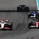 MIAMI, FLORIDA - MAY 07: Nico Hulkenberg of Germany driving the (27) Haas F1 VF-23 Ferrari locks a wheel under braking as he overtakes Valtteri Bottas of Finland driving the (77) Alfa Romeo F1 C43 Ferrari during the F1 Grand Prix of Miami at Miami International Autodrome on May 07, 2023 in Miami, Florida. (Photo by Mark Thompson/Getty Images)