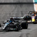 MIAMI, FLORIDA - MAY 07: George Russell of Great Britain driving the (63) Mercedes AMG Petronas F1 Team W14 leads Max Verstappen of the Netherlands driving the (1) Oracle Red Bull Racing RB19 during the F1 Grand Prix of Miami at Miami International Autodrome on May 07, 2023 in Miami, Florida. (Photo by Mark Thompson/Getty Images)