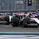 MIAMI, FLORIDA - MAY 07: Yuki Tsunoda of Japan driving the (22) Scuderia AlphaTauri AT04 leads Zhou Guanyu of China driving the (24) Alfa Romeo F1 C43 Ferrari during the F1 Grand Prix of Miami at Miami International Autodrome on May 07, 2023 in Miami, Florida. (Photo by Clive Mason - Formula 1/Formula 1 via Getty Images)
