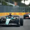 MIAMI, FLORIDA - MAY 07: Lance Stroll of Canada driving the (18) Aston Martin AMR23 Mercedes leads Kevin Magnussen of Denmark driving the (20) Haas F1 VF-23 Ferrari during the F1 Grand Prix of Miami at Miami International Autodrome on May 07, 2023 in Miami, Florida. (Photo by Jared C. Tilton/Getty Images)
