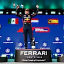 MIAMI, FLORIDA - MAY 07: Race winner Max Verstappen of the Netherlands and Oracle Red Bull Racing (C) celebrates on the podium between Second placed Sergio Perez of Mexico and Oracle Red Bull Racing (L) and Third placed Fernando Alonso of Spain and Aston Martin F1 Team (R) during the F1 Grand Prix of Miami at Miami International Autodrome on May 07, 2023 in Miami, Florida. (Photo by Dan Istitene - Formula 1/Formula 1 via Getty Images)