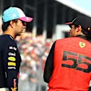 MIAMI, FLORIDA - MAY 06: Pole position qualifier Sergio Perez of Mexico and Oracle Red Bull Racing and Third placed qualifier Carlos Sainz of Spain and Ferrari talk in parc ferme during qualifying ahead of the F1 Grand Prix of Miami at Miami International Autodrome on May 06, 2023 in Miami, Florida. (Photo by Mark Thompson/Getty Images)