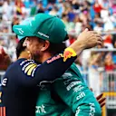 MIAMI, FLORIDA - MAY 06: Second placed qualifier Fernando Alonso of Spain and Aston Martin F1 Team and Pole position qualifier Sergio Perez of Mexico and Oracle Red Bull Racing talk in parc ferme during qualifying ahead of the F1 Grand Prix of Miami at Miami International Autodrome on May 06, 2023 in Miami, Florida. (Photo by Mark Thompson/Getty Images)