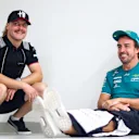 LUSAIL CITY, QATAR - OCTOBER 08: Fernando Alonso of Spain and Aston Martin F1 Team and Valtteri Bottas of Finland and Alfa Romeo F1 talk on the drivers parade prior to the F1 Grand Prix of Qatar at Lusail International Circuit on October 08, 2023 in Lusail City, Qatar. (Photo by Dan Istitene - Formula 1/Formula 1 via Getty Images)
