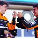 LUSAIL CITY, QATAR - OCTOBER 08: Second placed Oscar Piastri of Australia and McLaren and Third placed Lando Norris of Great Britain and McLaren celebrate in parc ferme during the F1 Grand Prix of Qatar at Lusail International Circuit on October 08, 2023 in Lusail City, Qatar. (Photo by Dan Istitene - Formula 1/Formula 1 via Getty Images)