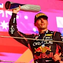 LUSAIL CITY, QATAR - OCTOBER 08: Race winner Max Verstappen of the Netherlands and Oracle Red Bull Racing celebrates on the podium during the F1 Grand Prix of Qatar at Lusail International Circuit on October 08, 2023 in Lusail City, Qatar. (Photo by Mark Thompson/Getty Images)