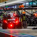 LUSAIL CITY, QATAR - OCTOBER 08: Zhou Guanyu of China driving the (24) Alfa Romeo F1 C43 Ferrari makes a pitstop during the F1 Grand Prix of Qatar at Lusail International Circuit on October 08, 2023 in Lusail City, Qatar. (Photo by Mark Thompson/Getty Images)