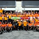 LUSAIL CITY, QATAR - OCTOBER 08: Second placed Oscar Piastri of Australia and McLaren and Third placed Lando Norris of Great Britain and McLaren celebrate with their team after the F1 Grand Prix of Qatar at Lusail International Circuit on October 08, 2023 in Lusail City, Qatar. (Photo by Clive Rose/Getty Images)