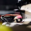 LUSAIL CITY, QATAR - OCTOBER 06: Liam Lawson of New Zealand and Scuderia AlphaTauri prepares to drive in the garage during qualifying ahead of the F1 Grand Prix of Qatar at Lusail International Circuit on October 06, 2023 in Lusail City, Qatar. (Photo by Rudy Carezzevoli/Getty Images)
