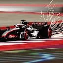 LUSAIL CITY, QATAR - OCTOBER 06: Sparks fly behind Kevin Magnussen of Denmark driving the (20) Haas F1 VF-23 Ferrari during qualifying ahead of the F1 Grand Prix of Qatar at Lusail International Circuit on October 06, 2023 in Lusail City, Qatar. (Photo by Clive Rose/Getty Images)