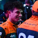 LUSAIL CITY, QATAR - OCTOBER 07: Third placed Lando Norris of Great Britain driving the (4) McLaren MCL60 Mercedes talks with sprint winner Oscar Piastri of Australia and McLaren in parc ferme after the Sprint ahead of the F1 Grand Prix of Qatar at Lusail International Circuit on October 07, 2023 in Lusail City, Qatar. (Photo by Rudy Carezzevoli/Getty Images)