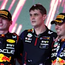 JEDDAH, SAUDI ARABIA - MARCH 19: Race winner Sergio Perez of Mexico and Oracle Red Bull Racing (R), Second placed Max Verstappen of the Netherlands and Oracle Red Bull Racing (L) and Ben Waterhouse, Head of Performance Engineering at Red Bull Racing, celebrate on the podium during the F1 Grand Prix of Saudi Arabia at Jeddah Corniche Circuit on March 19, 2023 in Jeddah, Saudi Arabia. (Photo by Lars Baron/Getty Images)