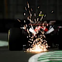 JEDDAH, SAUDI ARABIA - MARCH 17: Sparks fly behind Nico Hulkenberg of Germany driving the (27) Haas F1 VF-23 Ferrari during practice ahead of the F1 Grand Prix of Saudi Arabia at Jeddah Corniche Circuit on March 17, 2023 in Jeddah, Saudi Arabia. (Photo by Clive Mason/Getty Images)