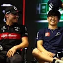 JEDDAH, SAUDI ARABIA - MARCH 16: Valtteri Bottas of Finland and Alfa Romeo F1 talks with Yuki Tsunoda of Japan and Scuderia AlphaTauri in the Drivers Press Conference during previews ahead of the F1 Grand Prix of Saudi Arabia at Jeddah Corniche Circuit on March 16, 2023 in Jeddah, Saudi Arabia. (Photo by Bryn Lennon/Getty Images)