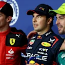 JEDDAH, SAUDI ARABIA - MARCH 18: Pole position qualifier Sergio Perez of Mexico and Oracle Red Bull Racing (C), Second placed qualifier Charles Leclerc of Monaco and Ferrari (L) and Third placed qualifier Fernando Alonso of Spain and Aston Martin F1 Team (R) pose for a photo in parc ferme during qualifying ahead of the F1 Grand Prix of Saudi Arabia at Jeddah Corniche Circuit on March 18, 2023 in Jeddah, Saudi Arabia. (Photo by Dan Istitene - Formula 1/Formula 1 via Getty Images)
