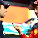 JEDDAH, SAUDI ARABIA - MARCH 18: Pole position qualifier Sergio Perez of Mexico and Oracle Red Bull Racing speaks to second place qualifier Charles Leclerc of Monaco and Ferrari in parc ferme after qualifying ahead of the F1 Grand Prix of Saudi Arabia at Jeddah Corniche Circuit on March 18, 2023 in Jeddah, Saudi Arabia. (Photo by Dan Istitene - Formula 1/Formula 1 via Getty Images)