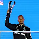 SINGAPORE, SINGAPORE - SEPTEMBER 17: Third placed Lewis Hamilton of Great Britain and Mercedes celebrates on the podium during the F1 Grand Prix of Singapore at Marina Bay Street Circuit on September 17, 2023 in Singapore, Singapore. (Photo by Clive Rose/Getty Images)