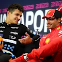 SINGAPORE, SINGAPORE - SEPTEMBER 17: Second placed Lando Norris of Great Britain and McLaren talks with race winner Carlos Sainz of Spain and Ferrari in a press conference after the F1 Grand Prix of Singapore at Marina Bay Street Circuit on September 17, 2023 in Singapore, Singapore. (Photo by Clive Mason/Getty Images)