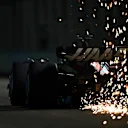 SINGAPORE, SINGAPORE - SEPTEMBER 16: Sparks fly from the car of Kevin Magnussen of Denmark driving the (20) Haas F1 VF-23 Ferrari during qualifying ahead of the F1 Grand Prix of Singapore at Marina Bay Street Circuit on September 16, 2023 in Singapore, Singapore. (Photo by Clive Mason/Getty Images)
