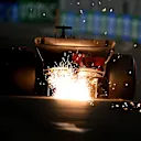 SINGAPORE, SINGAPORE - SEPTEMBER 16: Sparks fly behind Charles Leclerc of Monaco driving the (16) Ferrari SF-23 during qualifying ahead of the F1 Grand Prix of Singapore at Marina Bay Street Circuit on September 16, 2023 in Singapore, Singapore. (Photo by Clive Mason/Getty Images)