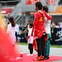 BARCELONA, SPAIN - JUNE 04: Carlos Sainz of Spain and Ferrari and Fernando Alonso of Spain and Aston Martin F1 Team interact on the grid prior to the F1 Grand Prix of Spain at Circuit de Barcelona-Catalunya on June 04, 2023 in Barcelona, Spain. (Photo by Dan Istitene - Formula 1/Formula 1 via Getty Images)
