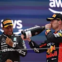BARCELONA, SPAIN - JUNE 04: Race winner Max Verstappen of the Netherlands and Oracle Red Bull Racing and Second placed Lewis Hamilton of Great Britain and Mercedes celebrate on the podium during the F1 Grand Prix of Spain at Circuit de Barcelona-Catalunya on June 04, 2023 in Barcelona, Spain. (Photo by Adam Pretty/Getty Images)