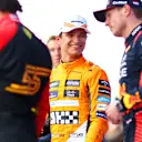 BARCELONA, SPAIN - JUNE 03: Third placed qualifier Lando Norris of Great Britain and McLaren smiles as he speaks with Pole position qualifier Max Verstappen of the Netherlands and Oracle Red Bull Racing and Second placed qualifier Carlos Sainz of Spain and Ferrari in parc ferme during qualifying ahead of the F1 Grand Prix of Spain at Circuit de Barcelona-Catalunya on June 03, 2023 in Barcelona, Spain. (Photo by Dan Istitene - Formula 1/Formula 1 via Getty Images)