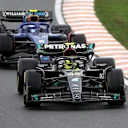 ZANDVOORT, NETHERLANDS - AUGUST 27: Lewis Hamilton of Great Britain driving the (44) Mercedes AMG Petronas F1 Team W14 leads Logan Sargeant of United States driving the (2) Williams FW45 Mercedes during the F1 Grand Prix of The Netherlands at Circuit Zandvoort on August 27, 2023 in Zandvoort, Netherlands. (Photo by Lars Baron/Getty Images)