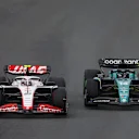 ZANDVOORT, NETHERLANDS - AUGUST 27: Nico Hulkenberg of Germany driving the (27) Haas F1 VF-23 Ferrari and Lance Stroll of Canada driving the (18) Aston Martin AMR23 Mercedes battle for track position during the F1 Grand Prix of The Netherlands at Circuit Zandvoort on August 27, 2023 in Zandvoort, Netherlands. (Photo by Lars Baron/Getty Images)