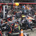 ZANDVOORT, NETHERLANDS - AUGUST 27: Sergio Perez of Mexico driving the (11) Oracle Red Bull Racing RB19 makes a pitstop in the rain during the F1 Grand Prix of The Netherlands at Circuit Zandvoort on August 27, 2023 in Zandvoort, Netherlands. (Photo by Peter Fox/Getty Images)